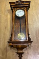 A good walnut Vienna single weight wall clock - missing finials but in running order 47cm wide