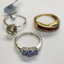 Three 9ct gold rings: Featuring a ruby and diamond ring, a white gold Tanzanite and diamond ring;