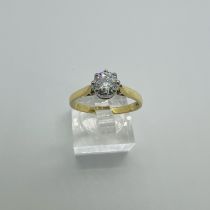 An 18ct gold synthetic Moissanite solitaire ring. Equivalent to a 2/3 carat diamond in spread.