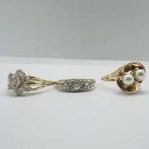 A collection of three dress rings. Featuring a 14ct yellow gold Cubic Zirconia (CZ) Victorian