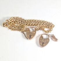 A double row charm bracelet with heart padlock clasp, marked "9c 375 EGB".  With functioning