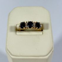 Sapphire & Diamond half hoop ring, stamped 14k. Size L. Gross weight 3.1grams approx.