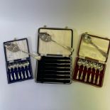 3 silver berry spoons and 3 boxed flatware sets.  Silver weight approximately 310 grams