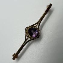 A 9ct amethyst and yellow gold diamond bar brooch.4.8 cm in length. Approximate gross weight 3.3