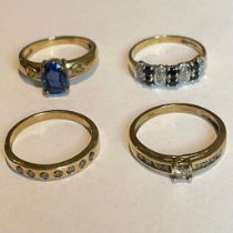 Collection of four 9ct yellow gold diamond and gem set rings. To include a sapphire and diamond