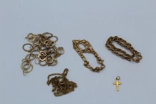 A collection of 9ct gold chains and a gold cross charm. Gross weight approximately 16.4gm