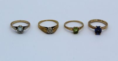 A collection of gem-set dress rings. Featuring a 9ct gold tanzanite solitaire, size J, a 9ct peridot