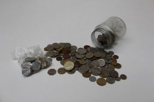 One jar of foreign coins including bag of Spanish coins with dates 1940-1945. Ten Diez cents etc