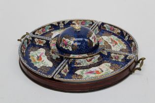 An Edwardian Booths supper set, retailed by Thomas Good. Polychrome decorated in the Worcester