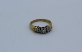 A diamond dress ring, featuring a central round brilliant cut diamond, estimated 0.20 carats,