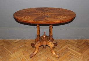 A late Victorian walnut, floral marquetery inlaid and strung loo table of small size, the oval top