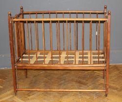 George Blake and Co, Oxford, an Edwardian beech collapsible cot/playpen with stick splats raised