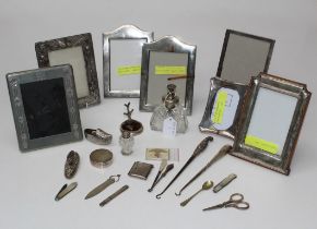 A collection of silver photograph frames together with various other silver items, to include