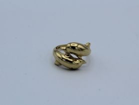 A yellow metal dolphin ring, stamped 585, size M, weight 4.0gm approximately