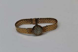 9ct gold ladies Roamer cocktail watch on a 9ct bracelet. Gross weight approximately 28.7gms