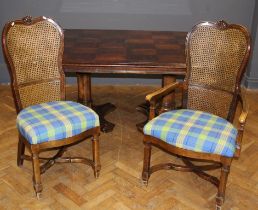 A reproduction twin pedestal extending dining table, the parquetry veneer top with two inset