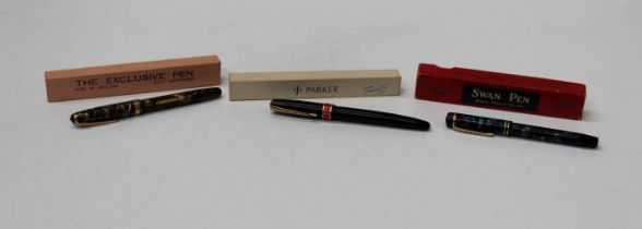 A collection of fountain pens, two featuring 14k gold nibs along wit a third, all boxed