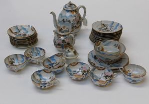 A mid 20th Century Japanese hand decorated porcelain tea service, thirty six pieces