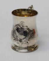 A George III silver tankard of baluster form, with leaf capped scroll handle, fine gilt interior,