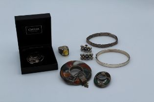 A collection of silver jewellery including two Victorian Scottish pebble brooches, an ortak