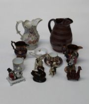 A mixed group of ceramics, including two copper lustre jugs, 11cm, a bat printed mug, treacle glazed