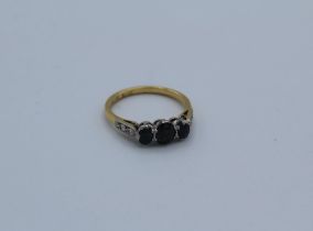 A sapphire and diamond dress ring, stamped 18ct plat to the shank, size N, gross weight