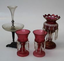 A pair of 20th century cranberry glass table lustres, each of inverted bell form, suspending