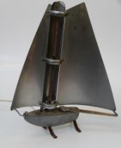 Bunting Electric Company Ltd, a mid century electric heater, modelled as a single masted sailing