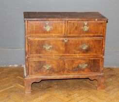 A small 19th century walnut, crossbanded and strung chest of two short and two long drawers,