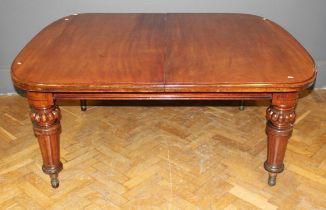 Edwards and Roberts, a William IV mahogany wind out extending dining table, the D end rectangular