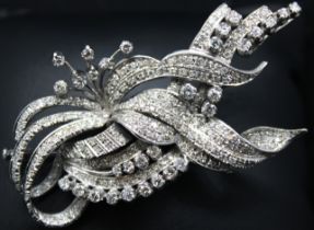 Unmarked white metal Diamond Floral Spray Brooch. Approx. 2.50ct total diamond weight.  Contains