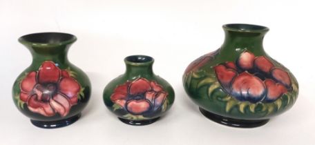 3 x Moorcroft green ground vases , various Moorcroft back stamps decorated in the Hibiscus