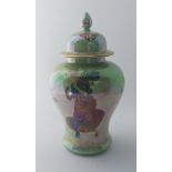 A Crown Devon lustrine Fieldings Fairyland baluster vase and cover, painted with fairies, printed