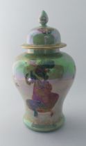A Crown Devon lustrine Fieldings Fairyland baluster vase and cover, painted with fairies, printed