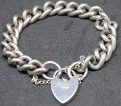 925 Sterling Silver Curb Link Bracelet with Padlock and Safety Chain.  The bracelet has got the Lion