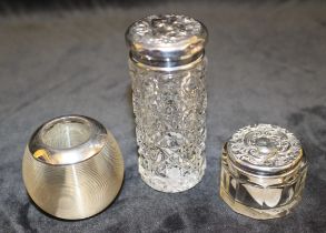 Two toilet jars and a vesta with silver mount. The two cut glass toilet jars tops are hallmarked