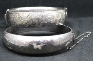 Two Sterling Silver Hinged Bangles.  One of them is hallmarked '925' for Sterling Silver and has a