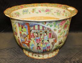 A Cantonese famille rose jardiniere, late 19th century, painted with panels of figures in interiors,