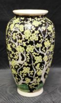 Late 19th Century Famille Noir Vase with an enameled yellow Blossom Tree decoration.  Baluster