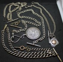 A collection of Albert watch chains. Featuring three sterling silver hallmarked chains, one with