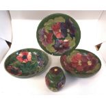 4 x Moorcroft green ground items , various Moorcroft back stamps. Impressed decorated in the