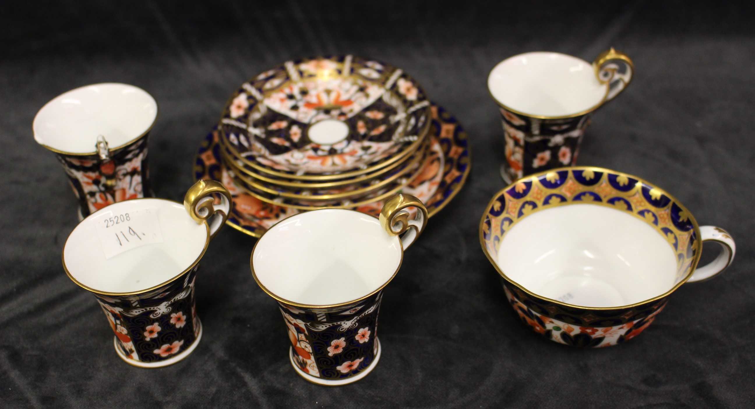 Four Royal Crown Derby coffee cups and three saucers, printed marks 2451 and a further tea cup and