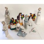 A collection of figures to include 5 Nao and 1 LLadro and 3 Royal Doulton. The Old Balloon Seller,