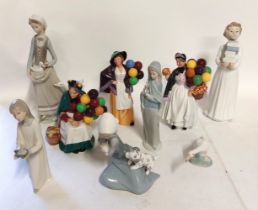 A collection of figures to include 5 Nao and 1 LLadro and 3 Royal Doulton. The Old Balloon Seller,