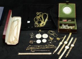A quantity of costume jewellery including: gold tone necklaces and silver tone necklaces, Boxed