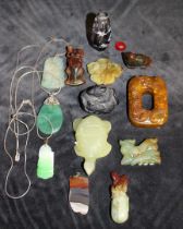A small collection of Chinese Jade and Hardstone. Carved pendants, snuff bottle, belt slide,