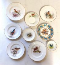 A collection of 9 small cabinet plates, side plates and trinket saucers by Royal Worcester, with