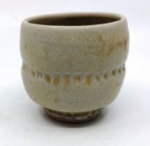 A Mike Dodd (born 1943). Stoneware small yunomi (tea cup). With an Impressed mark indistinct. stands