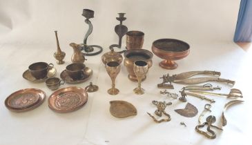 A selection of Copper and Brass items, to include cups and saucers, pin trays , candle sticks with