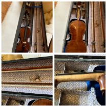 unmarked/labelled  Violin in original case complete with two bows a spare peg, strings and